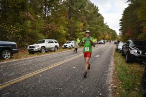 Eating a banana with jazz hands.