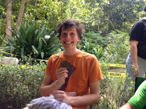 HURT 100 buckle accompanying a serial killer pose.